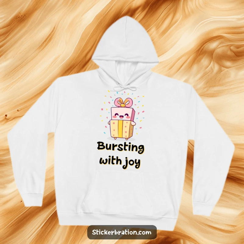Funny gift box hoodie with a smiling character bursting with confetti, offering cozy comfort and festive, celebratory humor.
