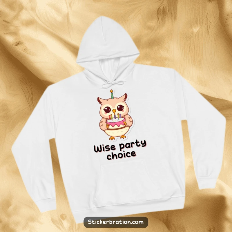 Funny cheerful owl character in a hoodie, holding a birthday cake with festive decorations.