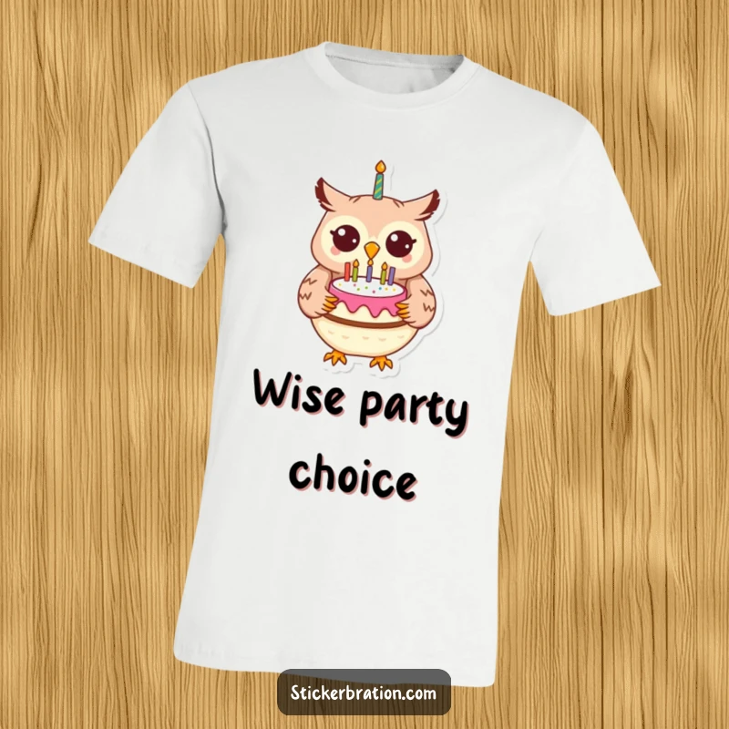 Funny cheerful owl wearing a party hat, holding a birthday cake with candles on a t-shirt.