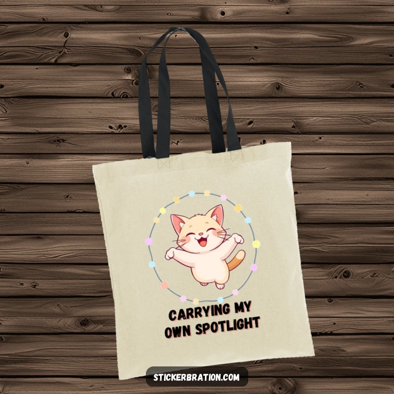 Funny cat tote bag showcasing a joyful cat leaping through a ring of illuminated lights, a humorous and practical accessory.